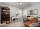 Bedroom featuring a desk, shelving and comfortable home office space at 6156 Kilchurn Dr, Fort Mill, SC 29707