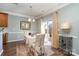 Cozy dining area with wood floors, chandelier, and sliding glass doors leading to the backyard at 6156 Kilchurn Dr, Fort Mill, SC 29707