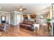Open-concept living room featuring hardwood floors and seamlessly connects to the kitchen area at 6156 Kilchurn Dr, Fort Mill, SC 29707