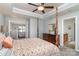 Open-concept primary bedroom with an ensuite bathroom and a view of the living room at 6156 Kilchurn Dr, Fort Mill, SC 29707