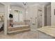 A well-lit bathroom features neutral colors, a tiled jacuzzi and a glass enclosed shower at 617 Beauhaven Ln, Waxhaw, NC 28173