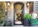 Welcoming entryway with decorative black door, brick exterior, and views into the light and bright living spaces at 617 Beauhaven Ln, Waxhaw, NC 28173
