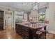 Spacious kitchen with a large central island, granite countertops, and stainless steel appliances at 617 Beauhaven Ln, Waxhaw, NC 28173