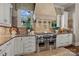 Gourmet kitchen featuring stainless steel appliances, custom cabinets, and granite countertops at 617 Beauhaven Ln, Waxhaw, NC 28173