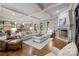 Spacious living room with a fireplace, coffered ceilings, and hardwood floors at 617 Beauhaven Ln, Waxhaw, NC 28173