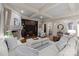 Elegant living room with a stone fireplace, built-in shelves, and hardwood floors at 617 Beauhaven Ln, Waxhaw, NC 28173