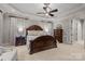 A spacious main bedroom features a trey ceiling, detailed trim, and dark wood furniture at 617 Beauhaven Ln, Waxhaw, NC 28173