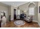 Upstairs sitting area with hardwood floors and decorative furnishings at 617 Beauhaven Ln, Waxhaw, NC 28173