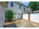 Townhouse backyard featuring white siding, a small yard, and brick fencing at 7007 Creft Cir, Indian Trail, NC 28079