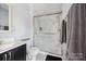 Bright bathroom featuring a glass-enclosed shower and modern fixtures at 7007 Creft Cir, Indian Trail, NC 28079