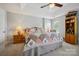 Spacious bedroom featuring a tray ceiling and a comfortable bed with floral patterned patchwork quilt at 7007 Creft Cir, Indian Trail, NC 28079
