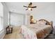 Cozy bedroom featuring carpet, a ceiling fan, and a comfy bed with a colorful quilt at 7007 Creft Cir, Indian Trail, NC 28079