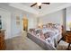 Cozy bedroom featuring a tray ceiling and a comfortable bed with floral patterned patchwork quilt at 7007 Creft Cir, Indian Trail, NC 28079