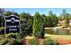 Sign for Connie's Pond featuring a tranquil pond with a fountain and lush landscaping at 7007 Creft Cir, Indian Trail, NC 28079