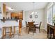 Cozy dining area adjacent to the kitchen, featuring a round table with seating for four and pendant lighting at 7007 Creft Cir, Indian Trail, NC 28079