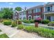 Charming townhouses with well-manicured landscaping, picket fences, and brick accents at 7007 Creft Cir, Indian Trail, NC 28079