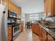Traditional kitchen with stainless steel appliances, granite countertops and a breakfast nook with natural light at 7007 Creft Cir, Indian Trail, NC 28079