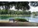 Scenic view of Lake Park with bench and landscaped shoreline, very serene and relaxing at 7007 Creft Cir, Indian Trail, NC 28079