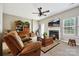 Bright living room with a fireplace, hardwood floors, and cozy seating area at 7007 Creft Cir, Indian Trail, NC 28079