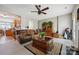 Cozy living room featuring hardwood floors, a fireplace, and a view of the kitchen at 7007 Creft Cir, Indian Trail, NC 28079