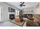 Comfortable living room with a fireplace, plush seating, and ample natural light at 7007 Creft Cir, Indian Trail, NC 28079