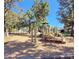 Community playground featuring modern play structures, monkey bars, and wood chip ground cover at 7007 Creft Cir, Indian Trail, NC 28079