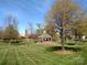 Picturesque town green featuring a gazebo, clock tower, benches, and lush landscaping under a bright blue sky at 7007 Creft Cir, Indian Trail, NC 28079