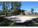 Sand volleyball court with net set up, surrounded by trees and community amenities at 7007 Creft Cir, Indian Trail, NC 28079