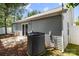 Side view of the backyard with a patio and AC unit at 7315 Gasper Ln, Fort Mill, SC 29707