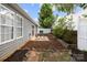 Backyard with a small patio area and landscaping at 7315 Gasper Ln, Fort Mill, SC 29707