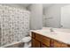 Bathroom featuring vanity with wood cabinets and a patterned shower curtain at 7315 Gasper Ln, Fort Mill, SC 29707