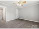 Bright bedroom with wood-look flooring and neutral paint at 7315 Gasper Ln, Fort Mill, SC 29707