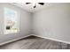 Bedroom with natural light and wood-look flooring at 7315 Gasper Ln, Fort Mill, SC 29707