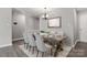 Dining room with wooden table and chairs, and a light-colored rug at 7315 Gasper Ln, Fort Mill, SC 29707