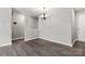 Open dining space features stylish flooring and contemporary chandelier at 7315 Gasper Ln, Fort Mill, SC 29707