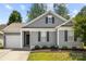 Charming one-story home features gray siding, black shutters, and a well-manicured lawn at 7315 Gasper Ln, Fort Mill, SC 29707