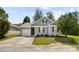 Charming gray home with a well-manicured lawn and mature landscaping at 7315 Gasper Ln, Fort Mill, SC 29707