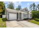 Charming gray home with well-kept lawn and attached one-car garage at 7315 Gasper Ln, Fort Mill, SC 29707