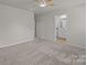 A bedroom with neutral colored walls, carpet and an ensuite bathroom at 853 Gerard Bay Dr, Fort Mill, SC 29715