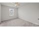 A simple bedroom with carpet and a ceiling fan at 853 Gerard Bay Dr, Fort Mill, SC 29715
