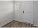 Bright entryway featuring stylish, modern flooring and a secure, white front door at 853 Gerard Bay Dr, Fort Mill, SC 29715