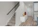 Hallway and staircase with a modern console table and wood and carpet flooring at 853 Gerard Bay Dr, Fort Mill, SC 29715
