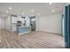 The modern kitchen features white cabinets, stainless steel appliances, and a center island at 853 Gerard Bay Dr, Fort Mill, SC 29715