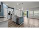 Open-concept kitchen featuring stainless steel appliances and a spacious island with granite countertop at 853 Gerard Bay Dr, Fort Mill, SC 29715
