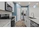 Modern kitchen with stainless steel appliances, granite counters, and stylish white cabinetry at 853 Gerard Bay Dr, Fort Mill, SC 29715