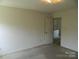 Bedroom view with an open door at 10516 Pickerel Ln, Charlotte, NC 28213