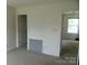 Bedroom featuring neutral walls and plush carpeting, with doors leading to other rooms at 10516 Pickerel Ln, Charlotte, NC 28213