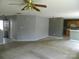 Open-concept living and dining area features carpeted flooring and neutral walls at 10516 Pickerel Ln, Charlotte, NC 28213