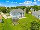Aerial view of a large backyard with lush lawn and outdoor entertainment area at 112 Doyle Farm Ln, Mooresville, NC 28115