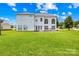 Expansive backyard featuring a well-maintained lawn and outdoor living space at 112 Doyle Farm Ln, Mooresville, NC 28115